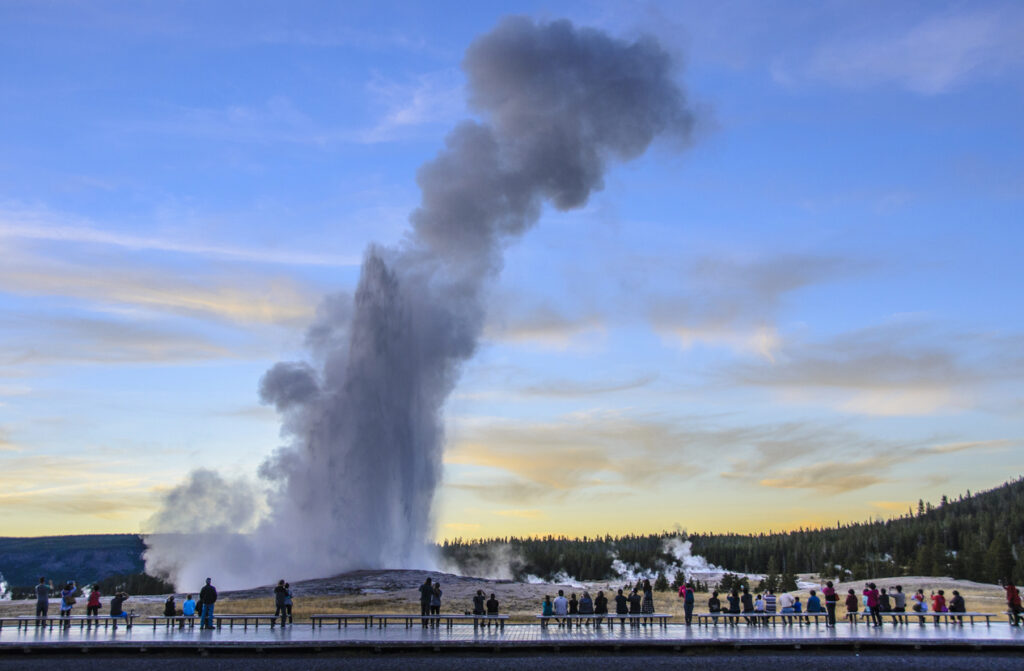Image of Old Faithful, Yellowstone National Park, and the Flexi Pave walkway, with people watching it