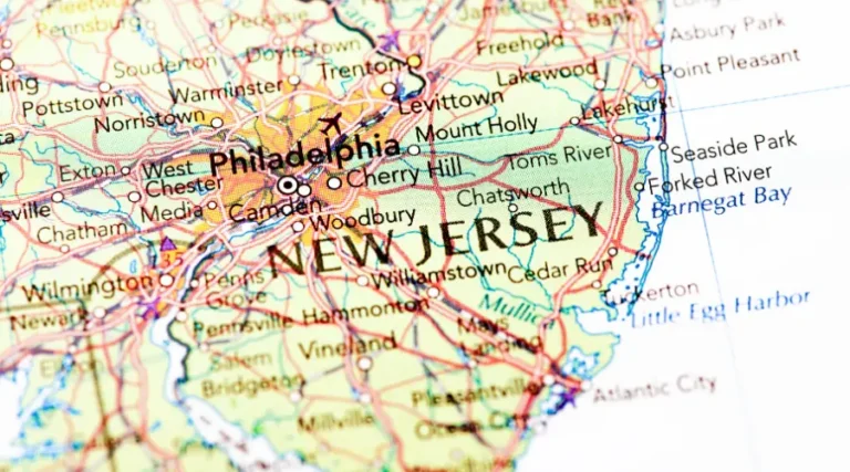 new-jersey-playground-surface-regulations 1 - Custom Park Surfacing - Custom Park Surfacing Colorful road map centered on New Jersey with labeled cities and the Atlantic coastline visible, nearby Philadelphia area shown.